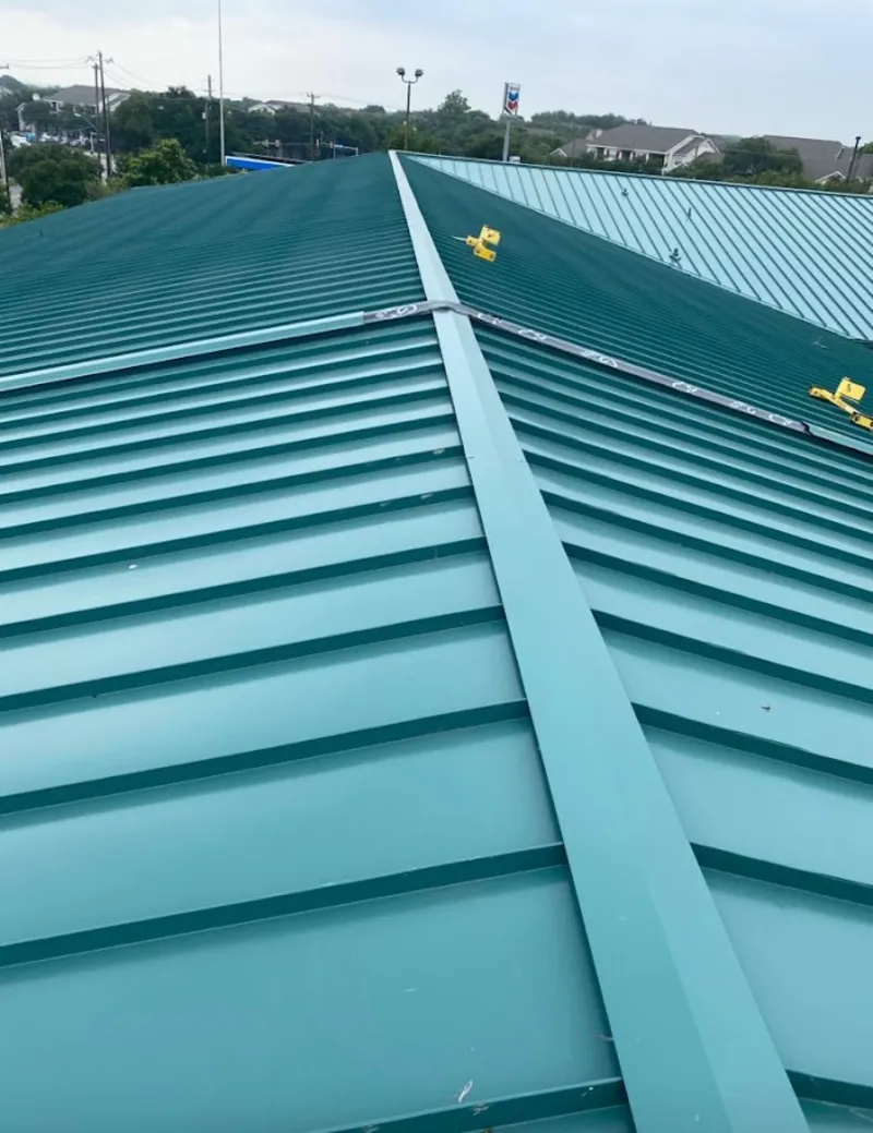 Green commercial metal roof ridge and valley for Metal Roof Repair in Fort Madison