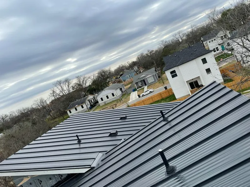 Standing seam metal roof panels with vents for Skylight Repair in Fort Madison